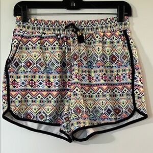 Red and Pink Athletic Shorts with Geometric Pattern